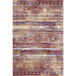 Vibrant rug with a traditional-inspired design featuring bold red, orange, and blue hues accented with intricate geometric patterns