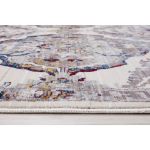 Bohemian-style Picasso Diamond Colorful Rug showcasing distressed patterns in shades of gold, gray, navy blue, and ivory.