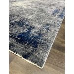 Teal and Gray Abstract Rug with luxurious soft fibers, perfect for bedrooms and cozy spaces.