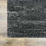 Timeless and versatile charcoal dark gray rug with a 1-inch plush pile and high-density construction for durability and elegance