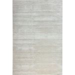 Cream beige short pile area rug with silky soft texture and neutral tones on hardwood flooring