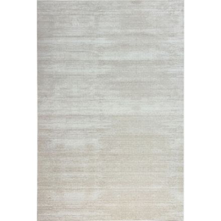 Cream beige short pile area rug with silky soft texture and neutral tones on hardwood flooring