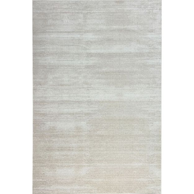 Cream beige short pile area rug with silky soft texture and neutral tones on hardwood flooring