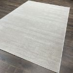 Close-up of cream beige short pile rug showcasing its smooth texture and premium quality design