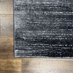 Close-up of Unity Charcoal Blue rug showcasing its elegant short pile and premium craftsmanship