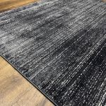 Deep charcoal blue minimalist rug with smooth texture perfect for modern home decor