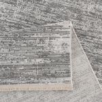 Minimalist Smyrna rug featuring soft textures and a refined gray, silver, and white color palette