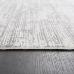 Premium-quality Smyrna collection rug with a contemporary faded design in muted gray and silver accents