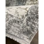 Faded vintage-style Smyrna rug featuring delicate patterns and muted colors perfect for traditional and modern interiors