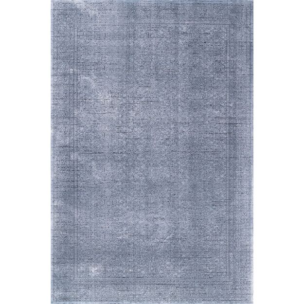 Smyrna Blue Dream Vintage Rug with Intricate Persian-Inspired Patterns and Fringed Edges on Dark Hardwood Floor