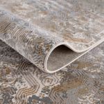 Smyrna luxurious area rug with soft textures and a serene color palette of gold and grayish blue