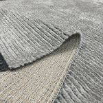 Sophisticated Mystique collection rug with subtle striped design and plush texture.