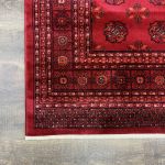 Vibrant crimson red and black oriental-style rug with intricate details Affordable and stylish machine-knotted Turkish rug for modern and traditional homes