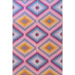 Pink Turkish kilim rug with colorful geometric tribal patterns for bohemian interiors