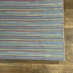 Lightweight Turkish flatwoven rug with bright colors and striped patterns for loft interiors