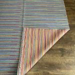 Flat-weave Turkish rug with colorful bohemian patterns for industrial or eclectic home spaces