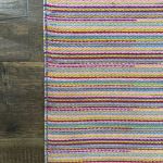 Turkish kilim rug with bold pink and colorful striped design for boho home decor